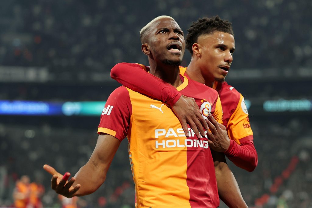 Galatasaray striker Victor Osimhen celebrates scoring against Besiktas with teammate Ismail Jakobs in the Turkish Super Lig