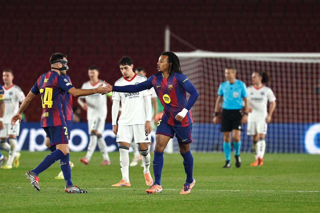 Eric Garcia and Jules Kounde celebrate during Barcelona's win over Eintracht Frankfurt in the Champions League.