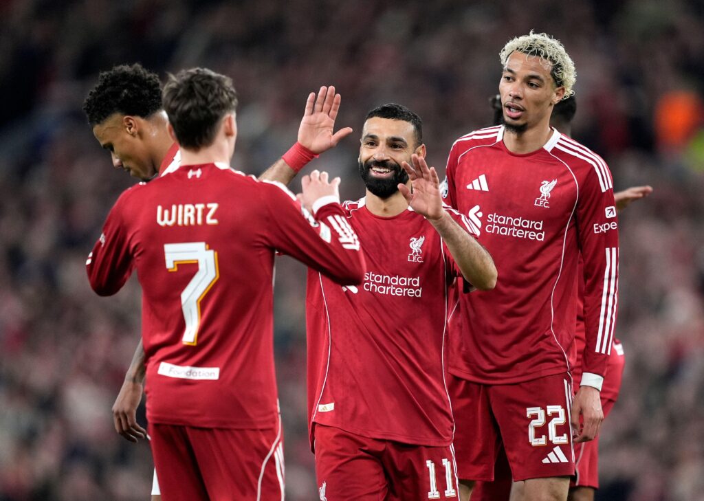 Liverpool forward Mohamed Salah celebrates with teammates Hugo Ekitike and Florian Wirtz