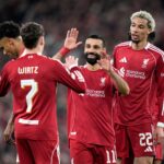 Liverpool forward Mohamed Salah celebrates with teammates Hugo Ekitike and Florian Wirtz