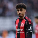 Eintracht Frankfurt left-back Nathaniel Brown looks on