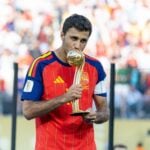 Spain midfielder Rodri with the Golden Ball award. The midfielder is wanted by both Barcelona and Real Madrid