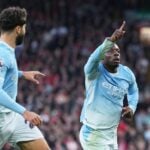 Jeremy Doku celebrates scoring for Man City against Liverpool