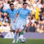 Elliot Anderson in action for Manchester City against Liverpool in the Premier League