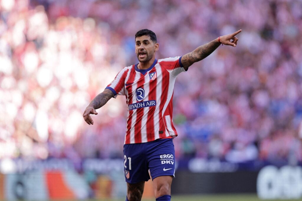 Atletico Madrid's Cristian Romero points during the La Liga game against Real Madrid
